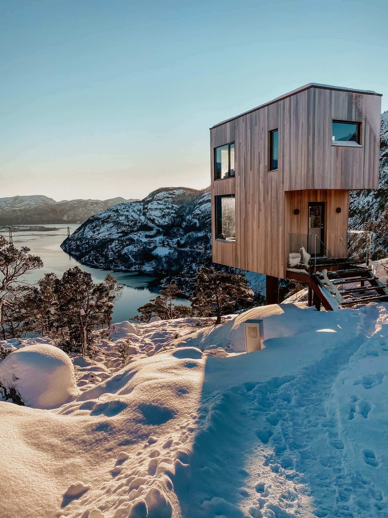 Compact wooden home on a rocky coastline